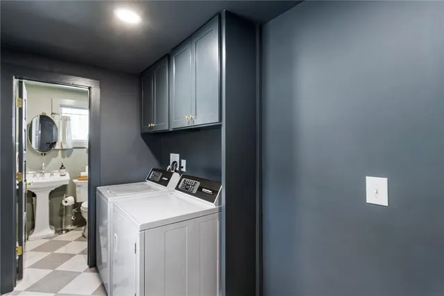 a bathroom with a toilet sink and mirror