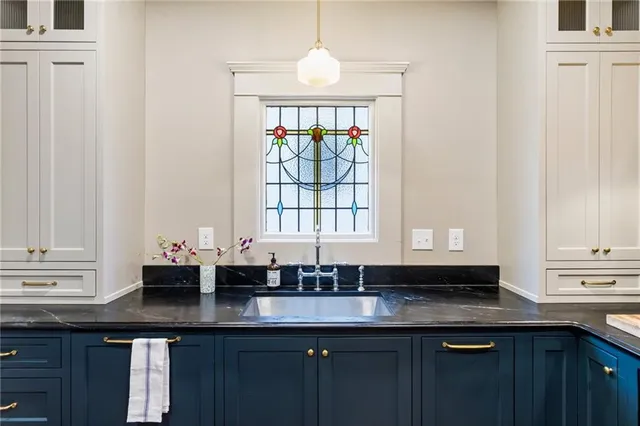 a kitchen with a sink and a window