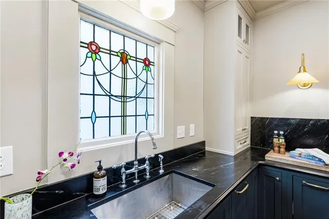 a kitchen with a sink and cabinets