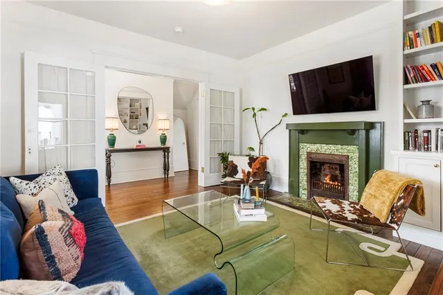 a living room with furniture and a fireplace