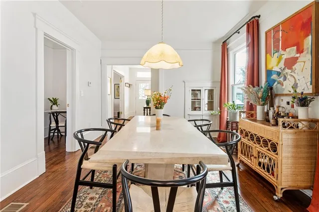 a dining room with furniture and window