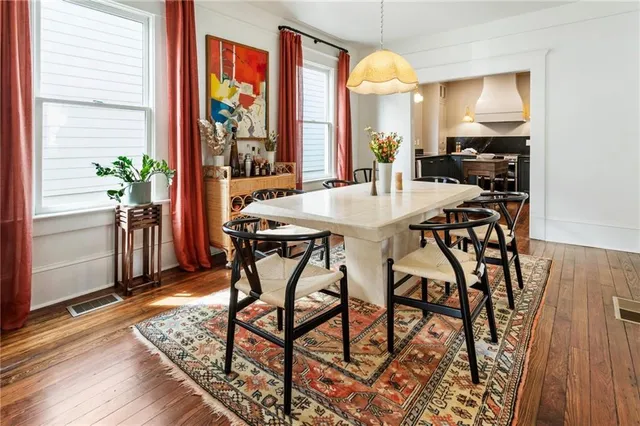 a view of a dining room with furniture window and wooden floor