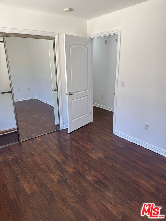 1312 Quintero Street, Unit 11 Los Angeles, CA 90026 - Photo 15 of 16 an empty room with wooden floor