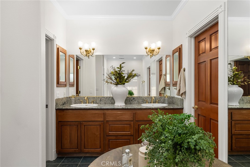 897 Filbert Avenue Chico, CA 95926 - Photo 34 of 66 a bathroom with a granite countertop sink a mirror and a shower