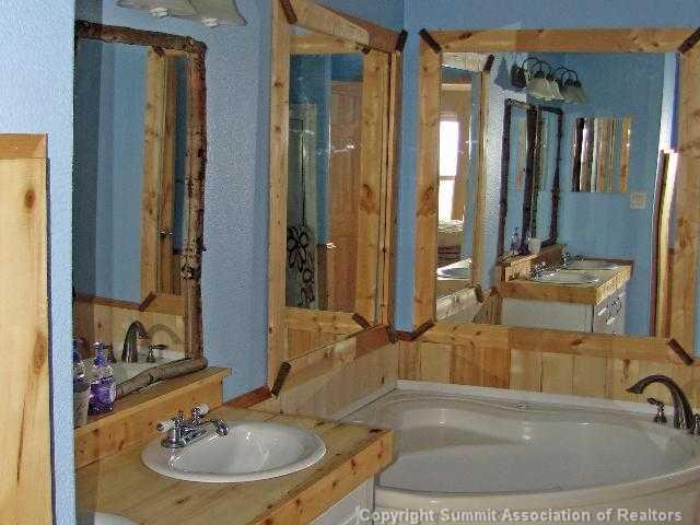 1723 Campfire Road Hartsel, CO 80449 - Photo 6 of 9 a bathroom with a sink and a mirror