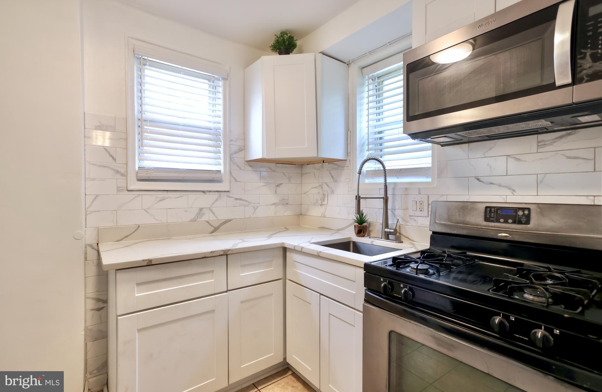 5424 B Street Southeast Washington, DC 20019 - Photo 9 of 28 KITCHEN WITH BUILT-IN MICROWAVE,