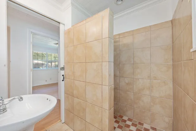 a bathroom with a bathtub and a shower