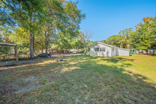 a house view with swimming pool in front of it