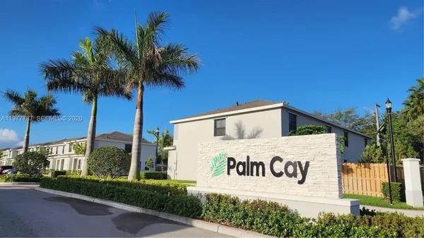 a sign that is on a pole on the side of a road