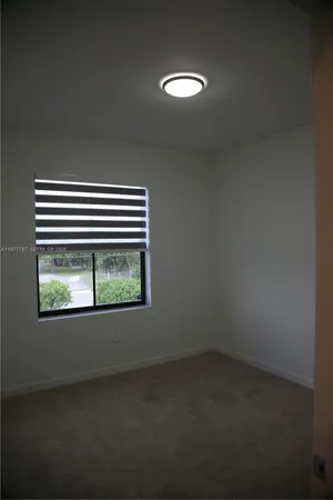 a view of empty room with windows