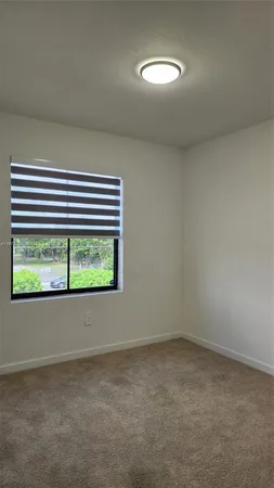 a view of a room that has a window