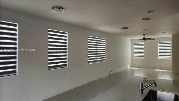 a view of empty room with windows