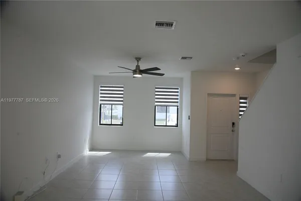 a view of an empty room with a window