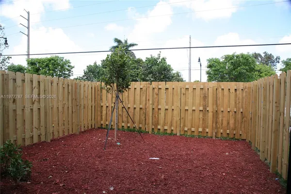 a view of a house with swimming pool and sitting area
