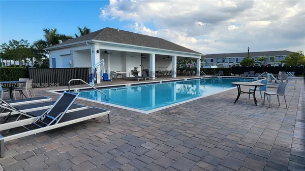 a view of a chairs and table in the terrace