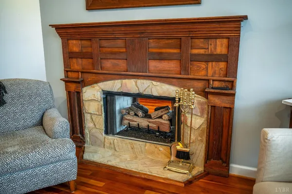 a open kitchen with stainless steel appliances granite countertop a stove and a wooden floors