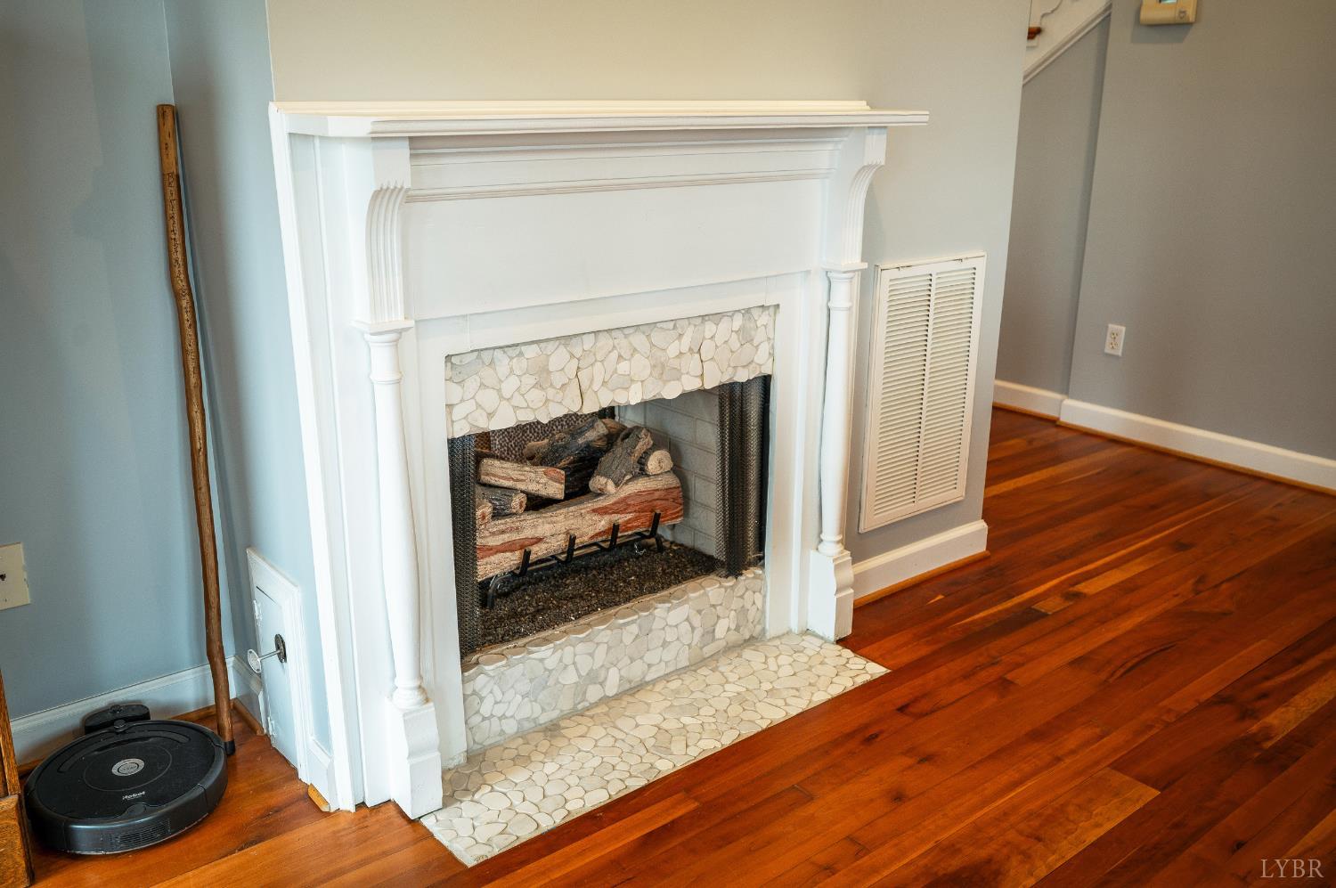 216 Burford Farm Road Monroe, VA 24574 - Photo 22 of 80 a living room with wooden floor and a fireplace