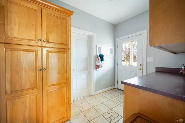 a living room with furniture a flat screen tv and gym equipment