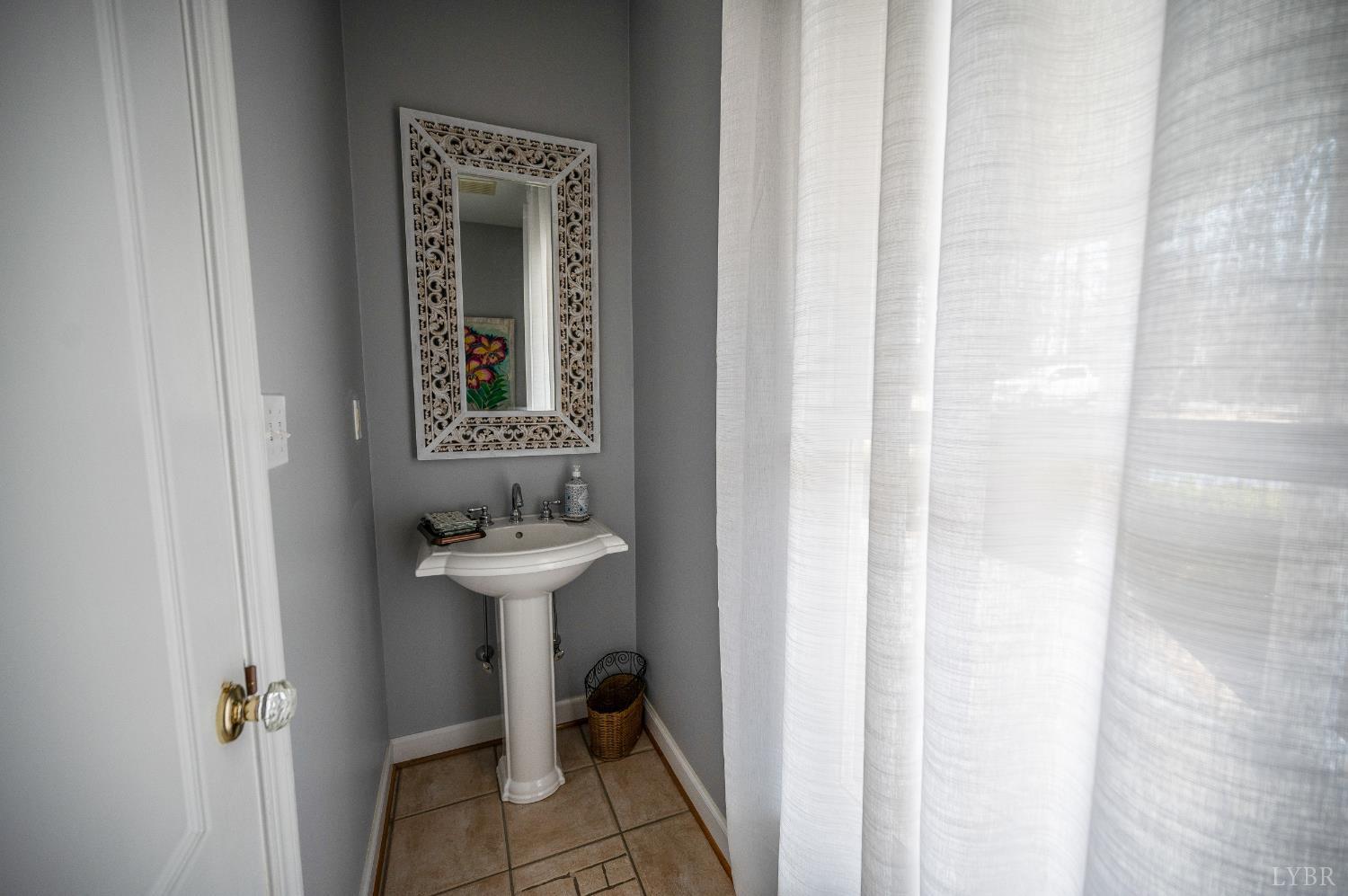 216 Burford Farm Road Monroe, VA 24574 - Photo 35 of 80 a bathroom with a sink and a mirror