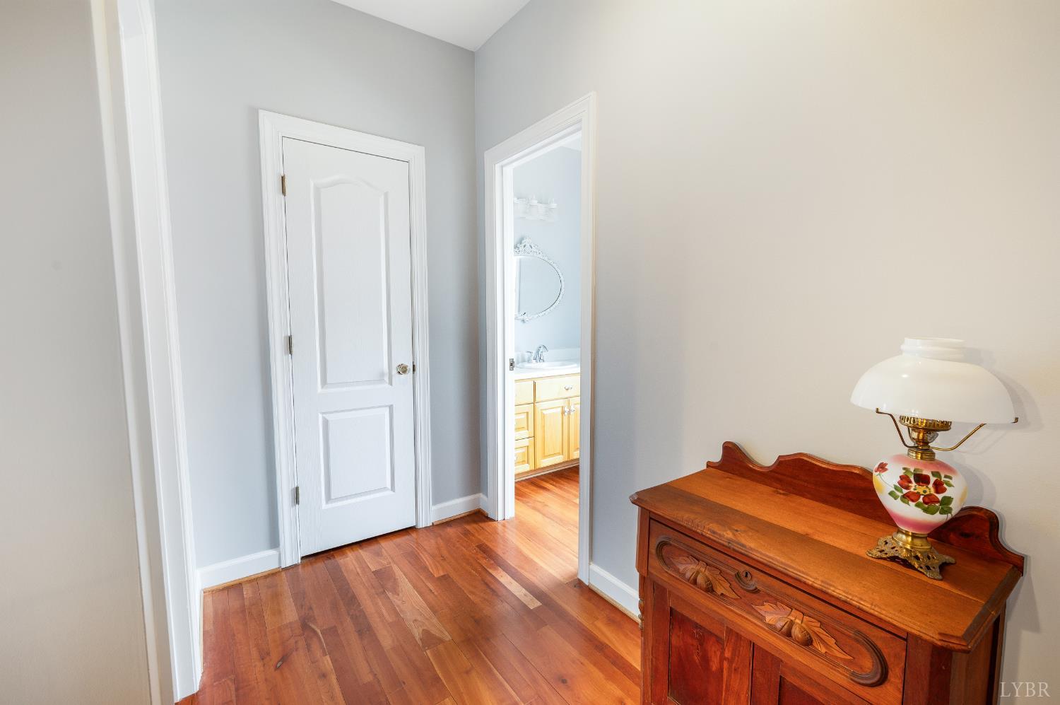 216 Burford Farm Road Monroe, VA 24574 - Photo 40 of 80 a room with a bed and a chandelier