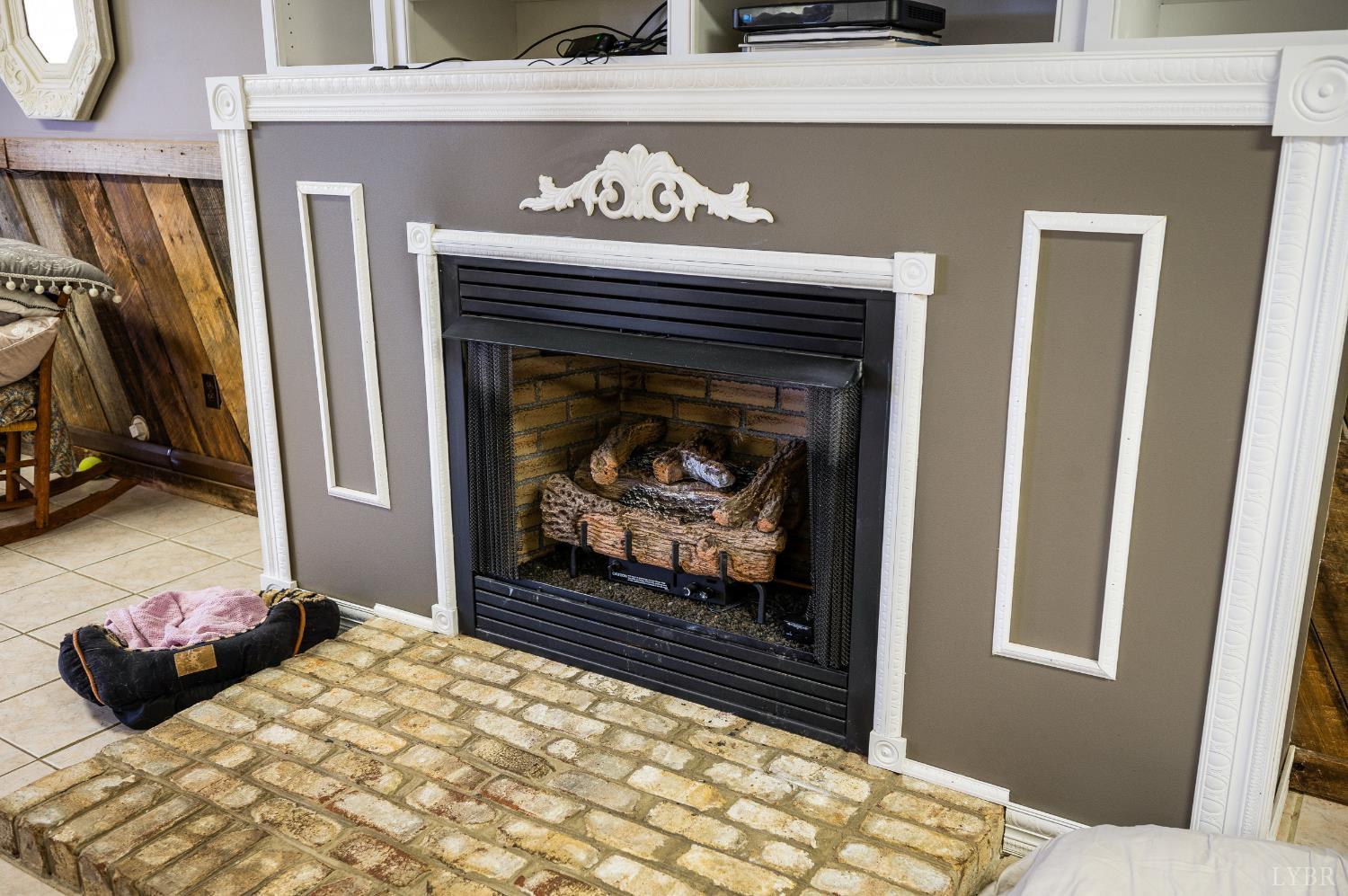 216 Burford Farm Road Monroe, VA 24574 - Photo 50 of 80 a bedroom with a bed and a fireplace