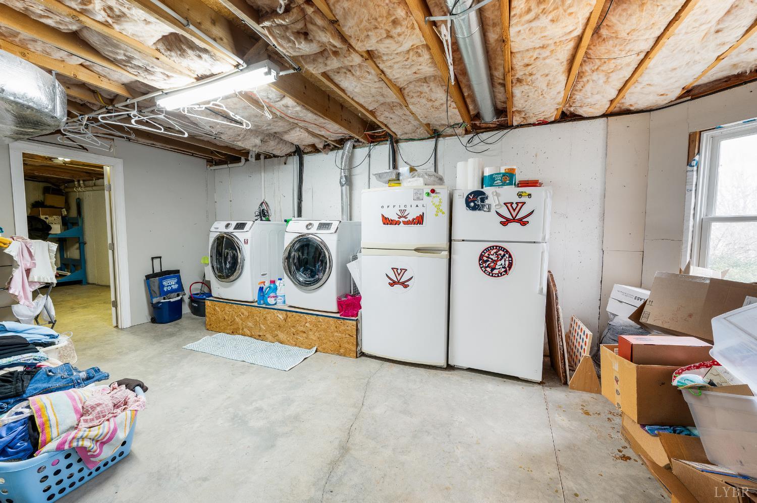 216 Burford Farm Road Monroe, VA 24574 - Photo 53 of 80 a utility room with fridge dryer and washer