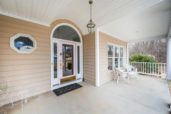 a kitchen with stainless steel appliances granite countertop wooden floors a stove a sink and a refrigerator