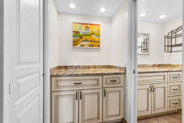 a stove top oven sitting inside of a kitchen