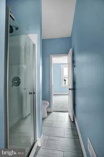 a view of an empty room with stairs