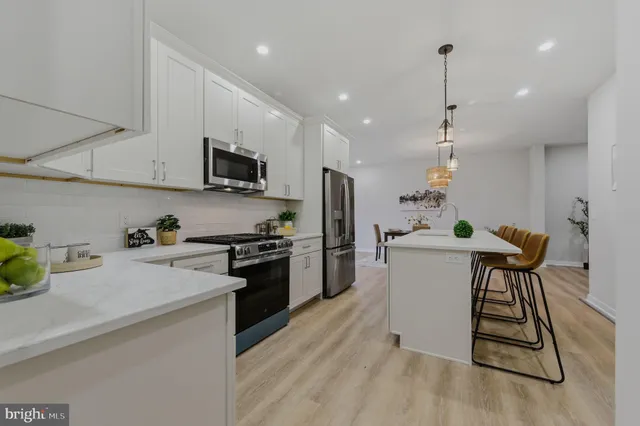a kitchen with a sink cabinets and stainless steel appliances
