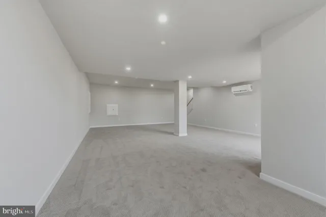 a view of a big room with a ceiling fan