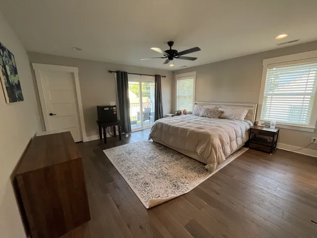 a bedroom with a bed and window