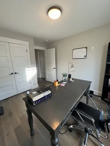 a bathroom with a shower sink vanity and toilet