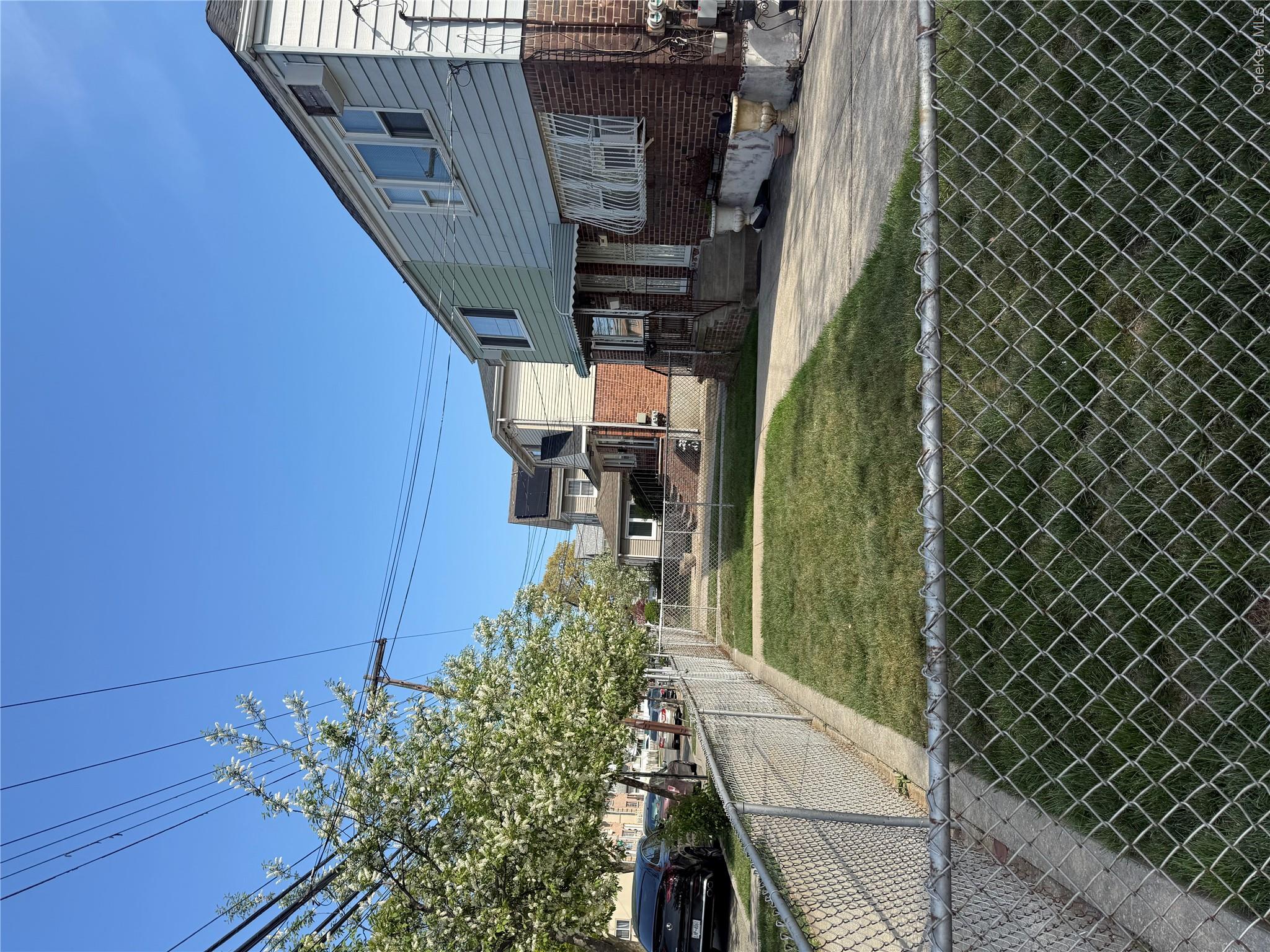 223-02 145th Road Queens, NY 11413 - Photo 4 of 6 a view of a house with a yard