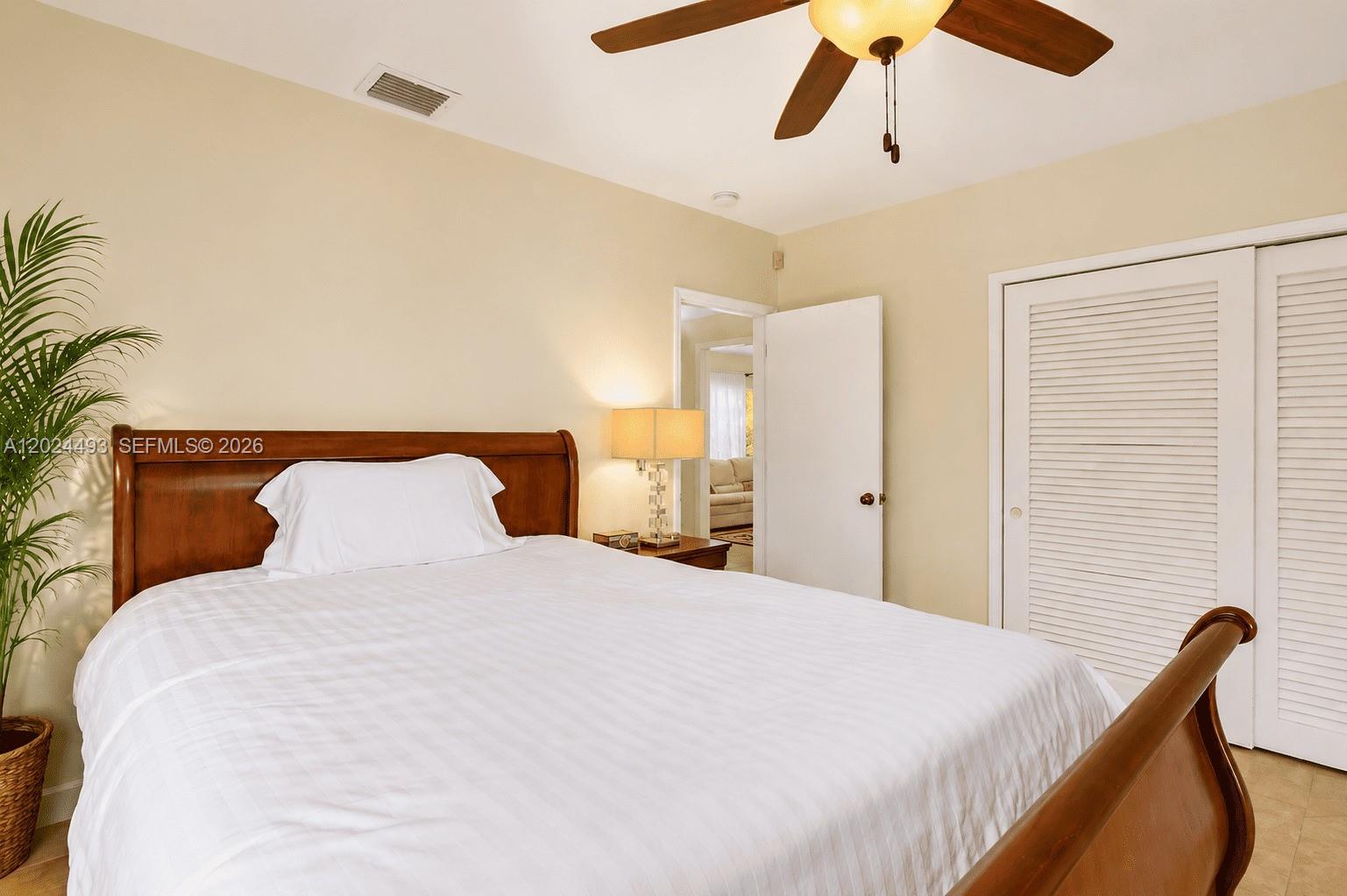 1995 Ixora Road North Miami, FL 33181 - Photo 12 of 23 a bedroom with a bed and a window