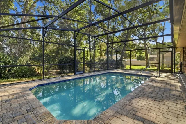 a view of a swimming pool with a sitting area