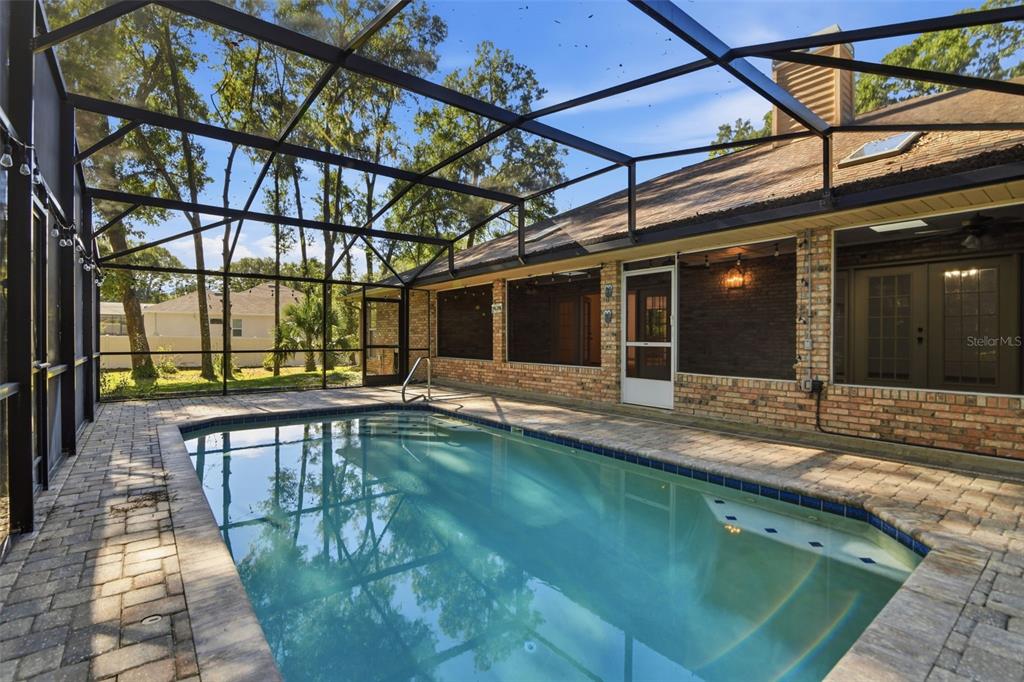 2409 South Spring Garden Avenue DeLand, FL 32720 - Photo 23 of 26 a view of a backyard with a swimming pool
