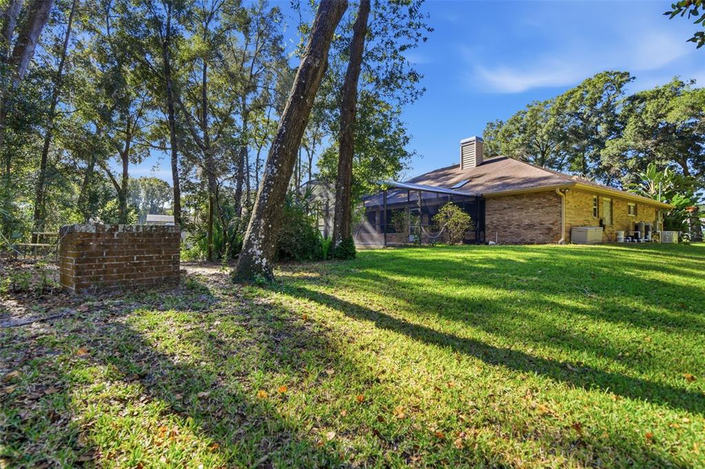 2409 South Spring Garden Avenue DeLand, FL 32720 - Photo 24 of 26 a view of a house with a yard