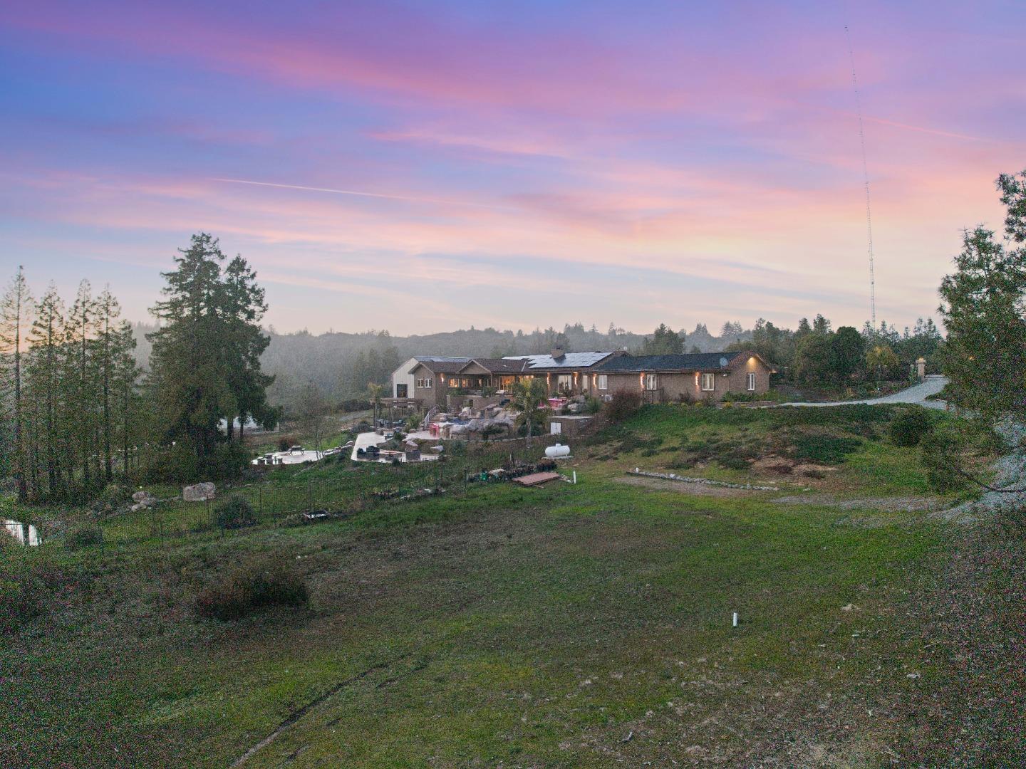 1061 Summit Road Watsonville, CA 95076 - Photo 19 of 92 a view of a grassy area with mountains and a houses