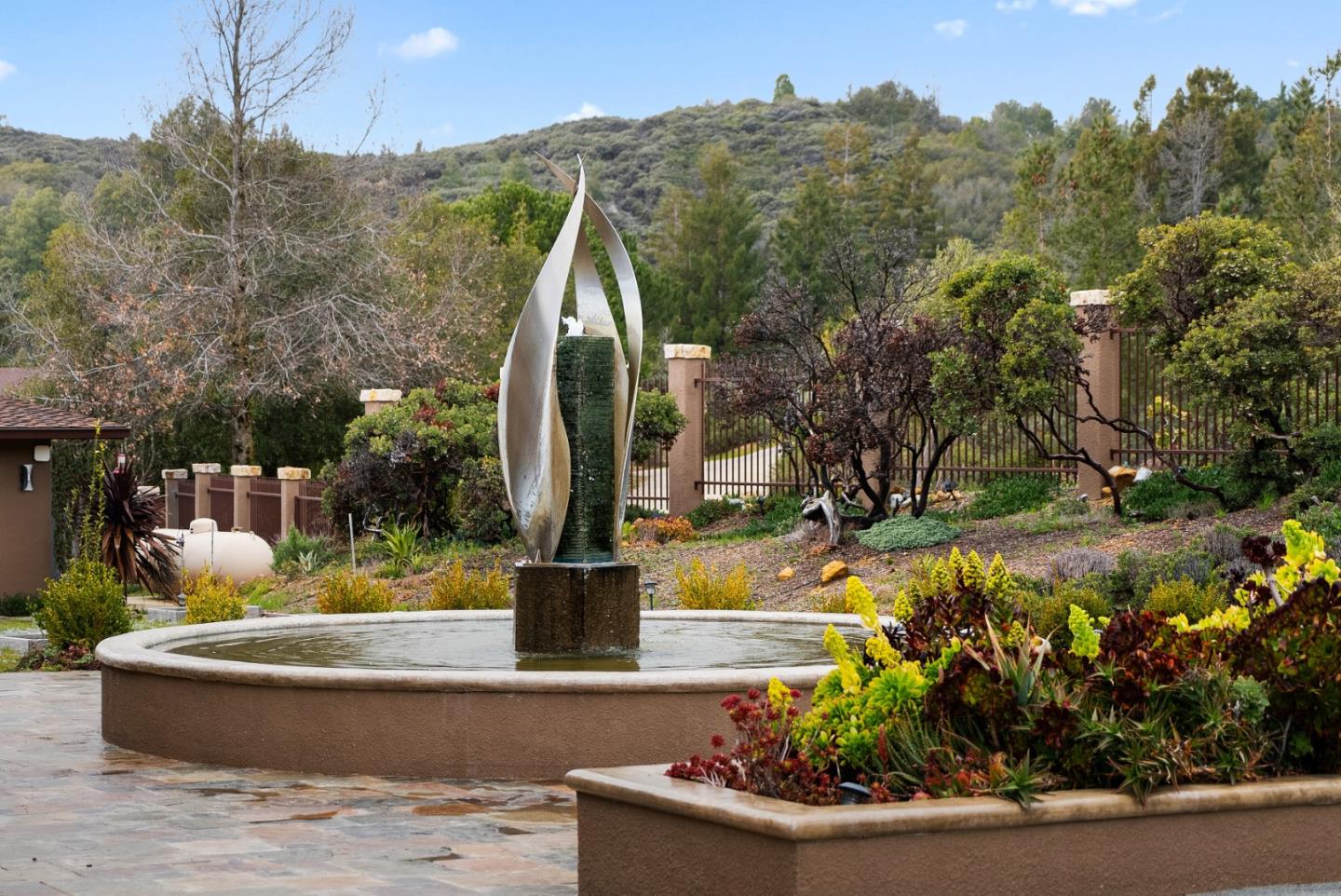 1061 Summit Road Watsonville, CA 95076 - Photo 24 of 92 a view of a fountain in the middle of a house