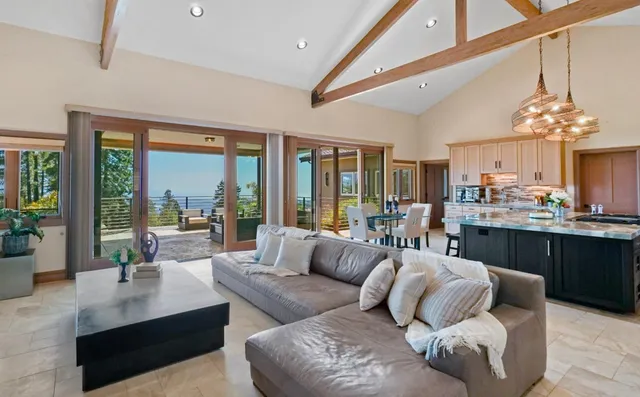 a view of a livingroom with a hardwood floor and a ceiling fan