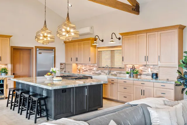 a living room with furniture tv and a window