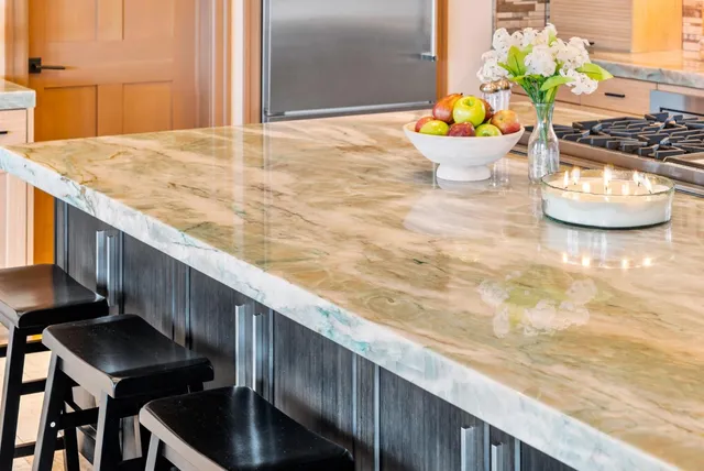 a bedroom with a bed couch and a window