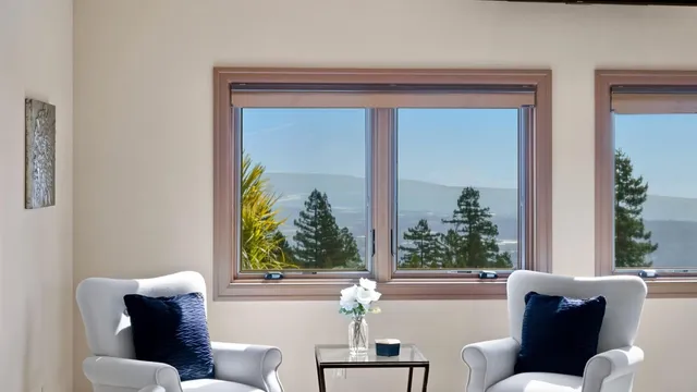 a view of a chairs and table in the house