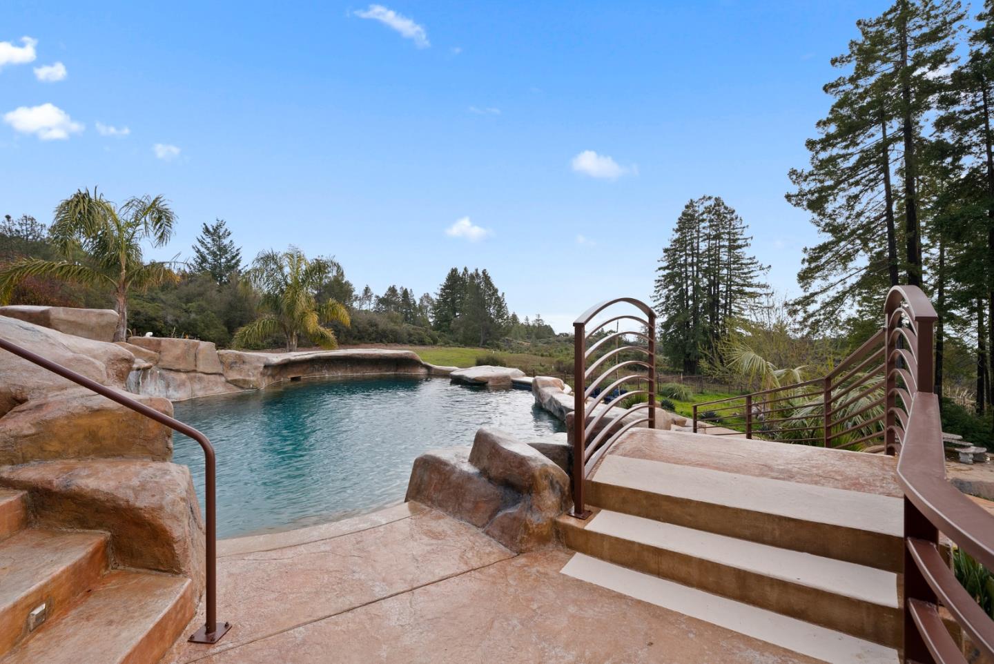 1061 Summit Road Watsonville, CA 95076 - Photo 54 of 84 a view of a swimming pool with a lounge chairs