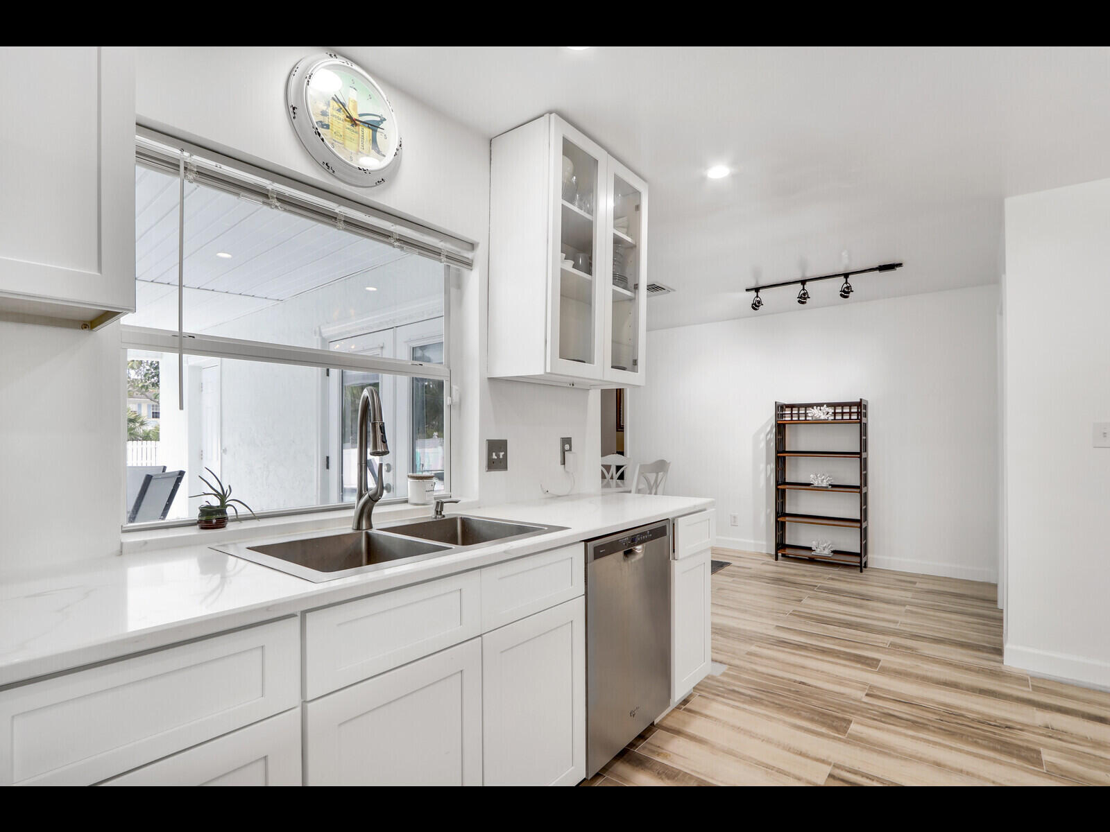 609 Oak Terrace Jupiter, FL 33458 - Photo 12 of 28 a kitchen with a sink and cabinets