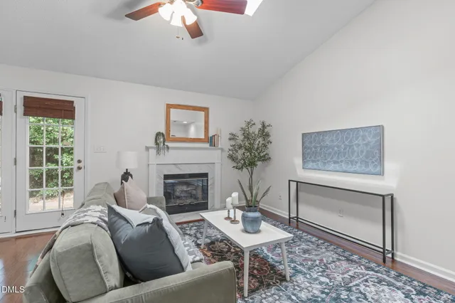 a living room with furniture and a fireplace