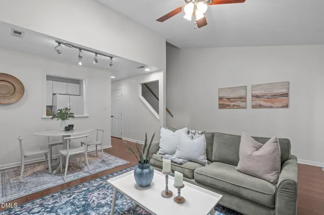a living room with furniture a window and a fireplace