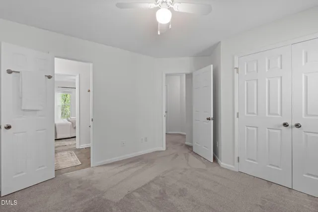 an empty room with closet area