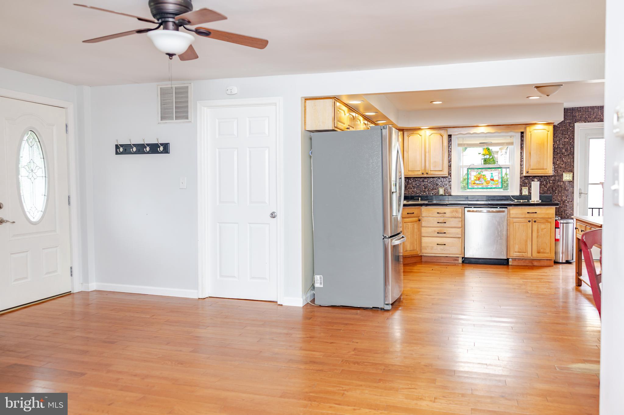 41 Plymouth Road Sicklerville, NJ 08081 - Photo 2 of 30 a view of a living room with hardwood floor and a ceiling fan